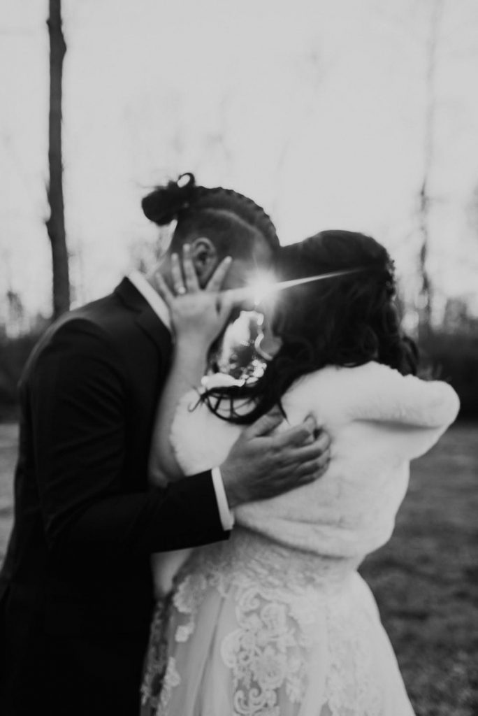 a couple sharing an Eskimo kiss on their wedding day